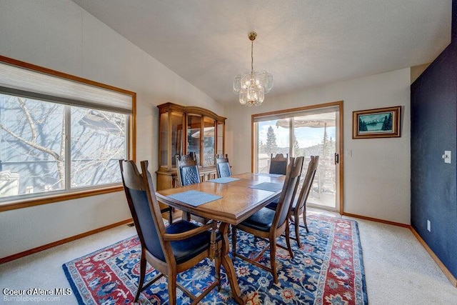 9218 W Rockford Bay Rd, Coeur Dalene, ID 83814 - dining space featuring a chandelier, plenty of natural light, light colored carpet, and lofted ceiling