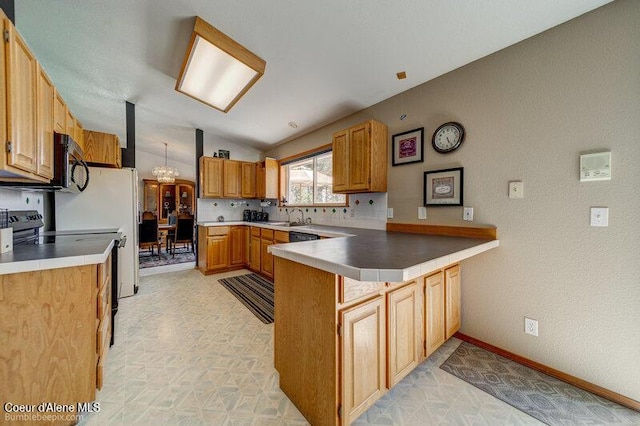 9218 W Rockford Bay Rd, Coeur Dalene, ID 83814 - kitchen with a peninsula, black range with electric stovetop, vaulted ceiling, a chandelier, and light countertops