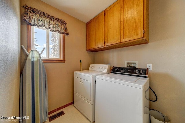9218 W Rockford Bay Rd, Coeur Dalene, ID 83814 - laundry area featuring cabinet space and independent washer and dryer