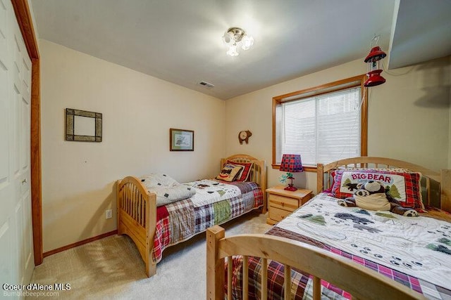 9218 W Rockford Bay Rd, Coeur Dalene, ID 83814 - bedroom featuring light carpet and baseboards
