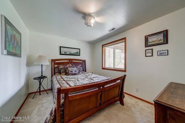9218 W Rockford Bay Rd, Coeur Dalene, ID 83814 - bedroom with light colored carpet and baseboards