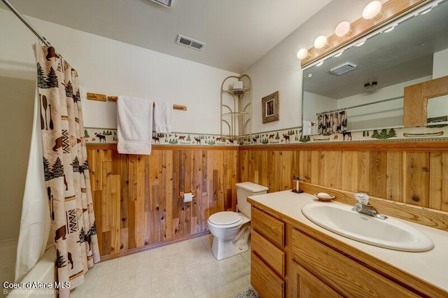 9218 W Rockford Bay Rd, Coeur Dalene, ID 83814 - bathroom with vanity, wood walls, a wainscoted wall, and shower / bathtub combination with curtain