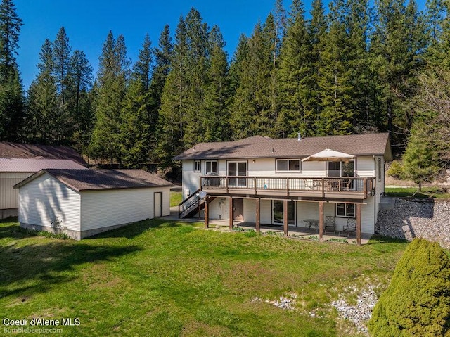9218 W Rockford Bay Rd, Coeur Dalene, ID 83814 - back of house with a wooden deck, a yard, stairway, a patio, and an outdoor structure