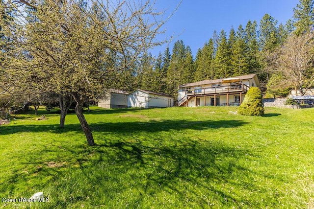 9218 W Rockford Bay Rd, Coeur Dalene, ID 83814 - view of grassy yard featuring a wooden deck