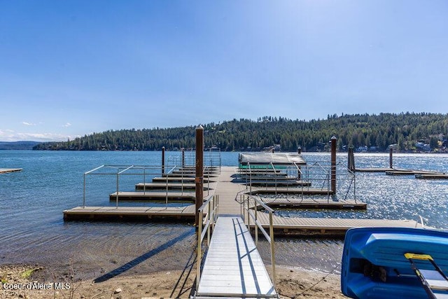 9218 W Rockford Bay Rd, Coeur Dalene, ID 83814 - dock with a forest view and a water view