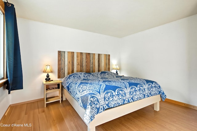 1655 Gun Club Rd, Sagle, ID 83860 - bedroom featuring wood finished floors and baseboards