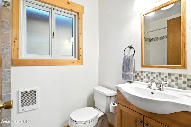 1655 Gun Club Rd, Sagle, ID 83860 - full bath with heating unit, vanity, decorative backsplash, and a shower