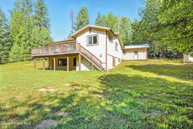 1655 Gun Club Rd, Sagle, ID 83860 - rear view of property with a wooden deck, stairs, and a lawn