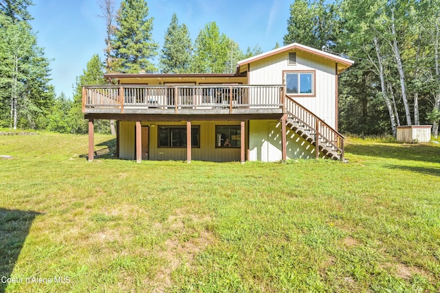 1655 Gun Club Rd, Sagle, ID 83860 - back of property with a wooden deck, stairway, and a lawn