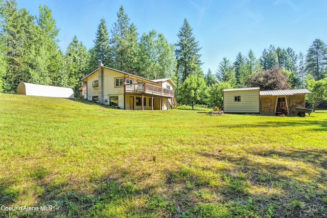 1655 Gun Club Rd, Sagle, ID 83860 - view of green lawn featuring a deck and an outbuilding