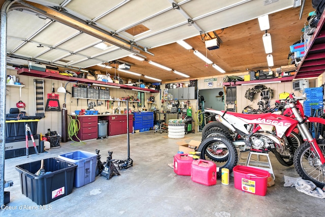 1655 Gun Club Rd, Sagle, ID 83860 - garage with a workshop area and a garage door opener