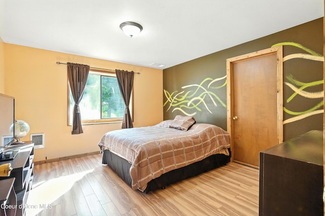 1655 Gun Club Rd, Sagle, ID 83860 - bedroom featuring wood finished floors and baseboards