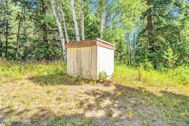 1655 Gun Club Rd, Sagle, ID 83860 - view of yard with a storage shed and a view of trees