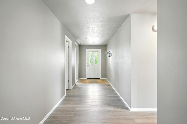 1254 E Bogie Dr, Post Falls, ID 83854 - entryway with baseboards and light wood-style floors
