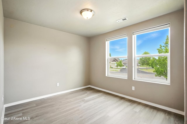 1254 E Bogie Dr, Post Falls, ID 83854 - empty room featuring light wood-style floors and baseboards