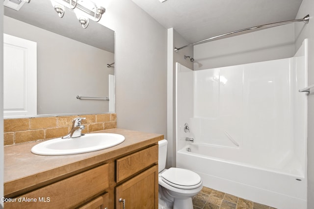 1254 E Bogie Dr, Post Falls, ID 83854 - full bathroom with tasteful backsplash, vanity, washtub / shower combination, and stone finish floors