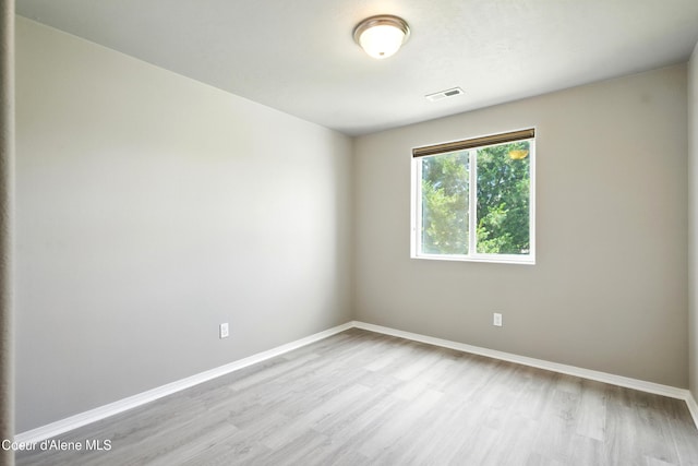 1254 E Bogie Dr, Post Falls, ID 83854 - empty room featuring wood finished floors and baseboards