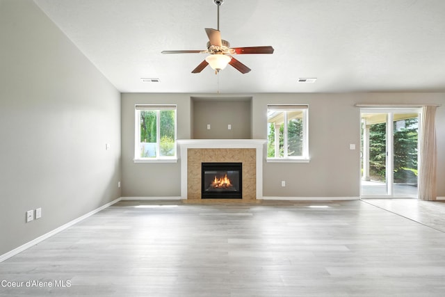 1254 E Bogie Dr, Post Falls, ID 83854 - unfurnished living room with a premium fireplace, wood finished floors, and ceiling fan