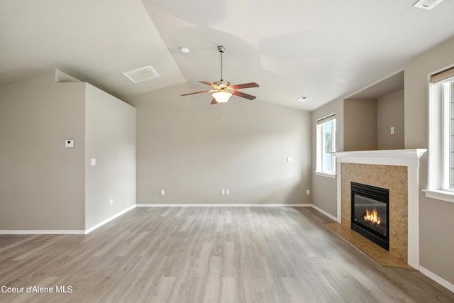 1254 E Bogie Dr, Post Falls, ID 83854 - unfurnished living room with a fireplace, light wood finished floors, a ceiling fan, and lofted ceiling