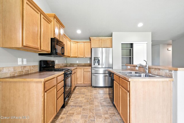 1254 E Bogie Dr, Post Falls, ID 83854 - kitchen featuring black appliances, light brown cabinetry, an island with sink, recessed lighting, and stone finish flooring