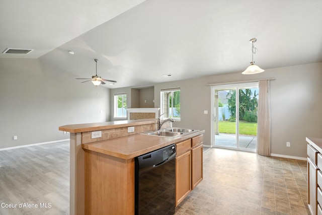 1254 E Bogie Dr, Post Falls, ID 83854 - kitchen featuring black dishwasher, plenty of natural light, a center island with sink, open floor plan, and lofted ceiling