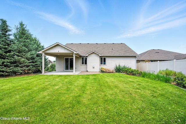 1254 E Bogie Dr, Post Falls, ID 83854 - back of property featuring a patio area and a shingled roof