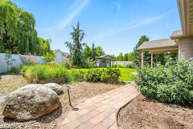 1254 E Bogie Dr, Post Falls, ID 83854 - fenced backyard with an outdoor structure