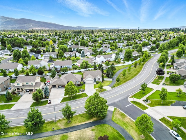 1254 E Bogie Dr, Post Falls, ID 83854 - aerial perspective of suburban area with a mountainous background