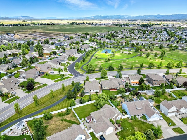 1254 E Bogie Dr, Post Falls, ID 83854 - aerial overview of property's location with a mountain backdrop and nearby suburban area