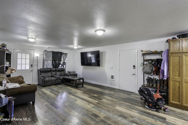 517 N Stephen St, Clark Fork, ID 83811 - living area with a textured ceiling and wood finished floors