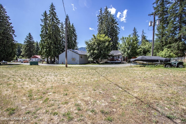 517 N Stephen St, Clark Fork, ID 83811 - view of green lawn featuring a deck