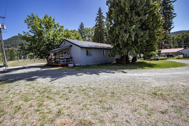 517 N Stephen St, Clark Fork, ID 83811 - view of home's exterior featuring a yard and a mountain view