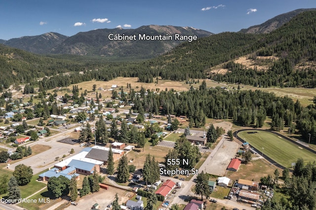 517 N Stephen St, Clark Fork, ID 83811 - aerial view of property's location featuring a mountain backdrop and a forest