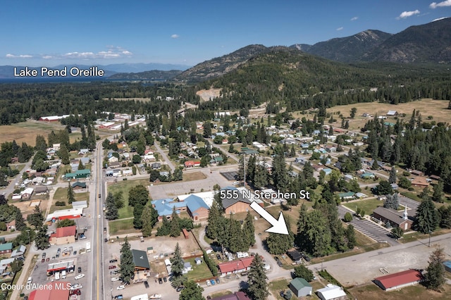 517 N Stephen St, Clark Fork, ID 83811 - aerial overview of property's location featuring a mountain backdrop and a forest