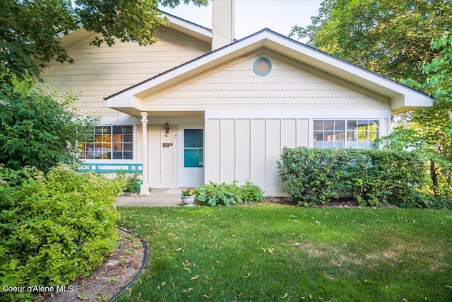 4922 W Village Blvd # 5, Rathdrum, ID 83858 - view of front facade with board and batten siding and a front yard