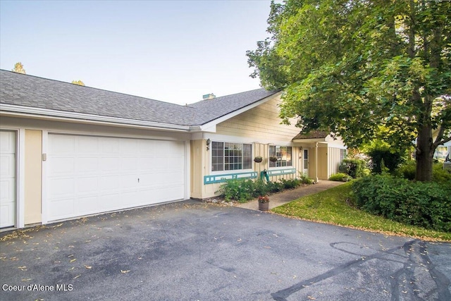4922 W Village Blvd # 5, Rathdrum, ID 83858 - single story home with asphalt driveway and a garage