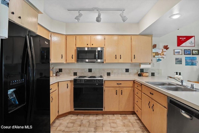 4922 W Village Blvd # 5, Rathdrum, ID 83858 - kitchen with black appliances, light countertops, track lighting, and light brown cabinetry