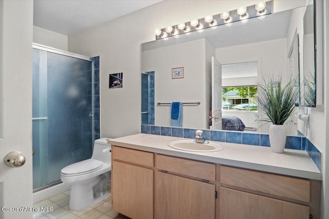 4922 W Village Blvd # 5, Rathdrum, ID 83858 - bathroom featuring vanity, a shower stall, tile patterned flooring, and connected bathroom