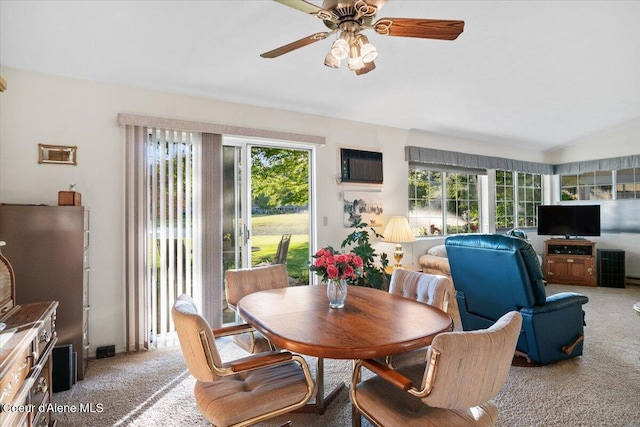 4922 W Village Blvd # 5, Rathdrum, ID 83858 - dining space featuring light colored carpet, a wall mounted AC, ceiling fan, and lofted ceiling