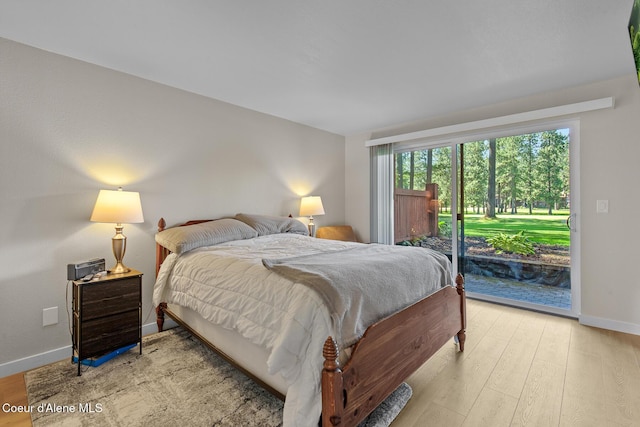5299 W Green Ct # 23, Rathdrum, ID 83858 - bedroom with access to outside and light wood-style floors