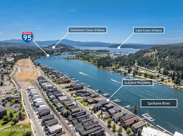 1758 W Bellerive Ln, Coeur Dalene, ID 83814 - aerial overview of property's location with a water and mountain view and a forest