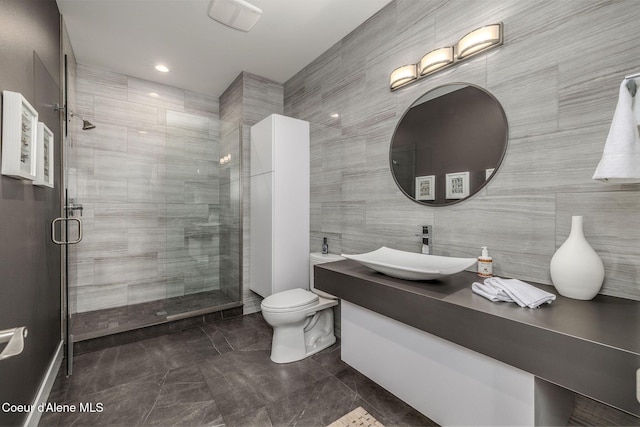 1758 W Bellerive Ln, Coeur Dalene, ID 83814 - bathroom with vanity, a shower stall, and tile walls