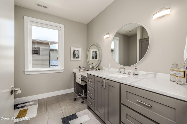 1758 W Bellerive Ln, Coeur Dalene, ID 83814 - bathroom featuring baseboards and vanity
