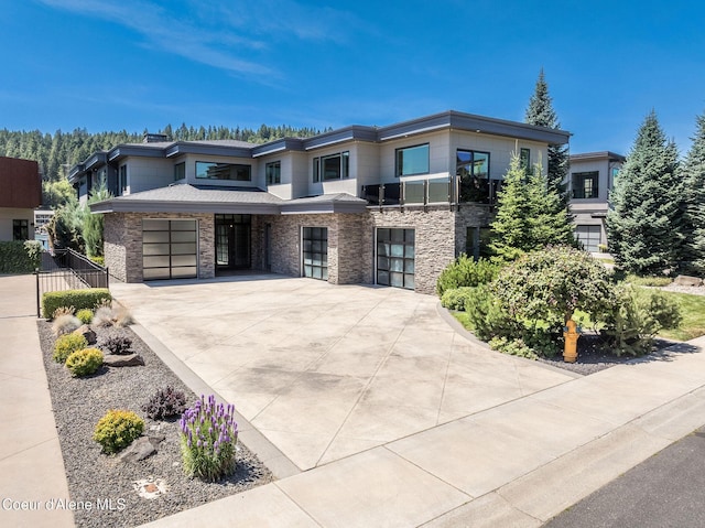 1758 W Bellerive Ln, Coeur Dalene, ID 83814 - view of front of house with driveway and stone siding