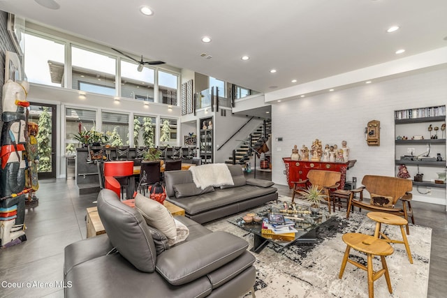 1758 W Bellerive Ln, Coeur Dalene, ID 83814 - living room featuring recessed lighting, stairway, and a towering ceiling