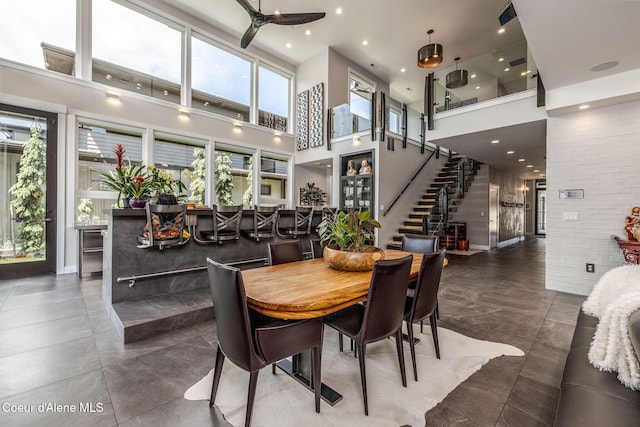 1758 W Bellerive Ln, Coeur Dalene, ID 83814 - dining space featuring a high ceiling, stairway, a ceiling fan, and recessed lighting
