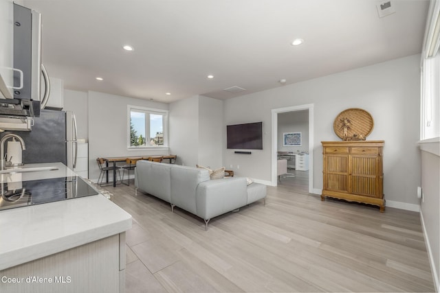 1758 W Bellerive Ln, Coeur Dalene, ID 83814 - living area featuring light wood finished floors and recessed lighting