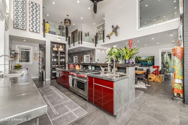 1758 W Bellerive Ln, Coeur Dalene, ID 83814 - kitchen featuring stainless steel countertops, a towering ceiling, double oven range, modern cabinets, and ceiling fan
