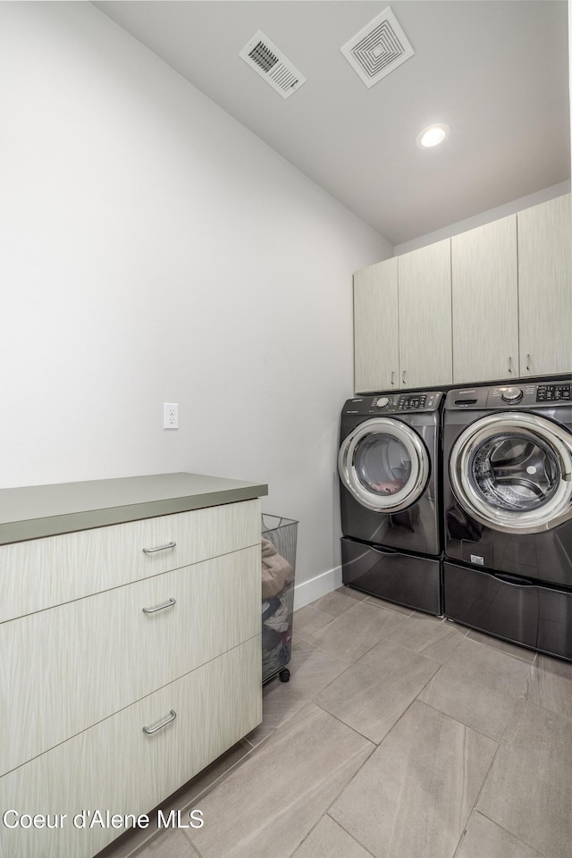 1758 W Bellerive Ln, Coeur Dalene, ID 83814 - laundry room featuring cabinet space, independent washer and dryer, recessed lighting, and light tile patterned floors