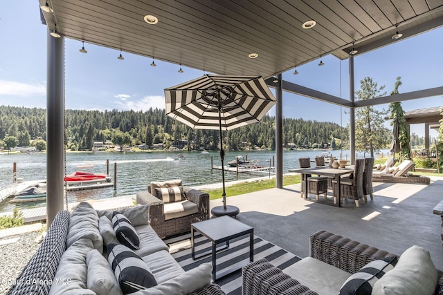 1758 W Bellerive Ln, Coeur Dalene, ID 83814 - view of patio featuring an outdoor hangout area, a wooded view, a water view, and a dock